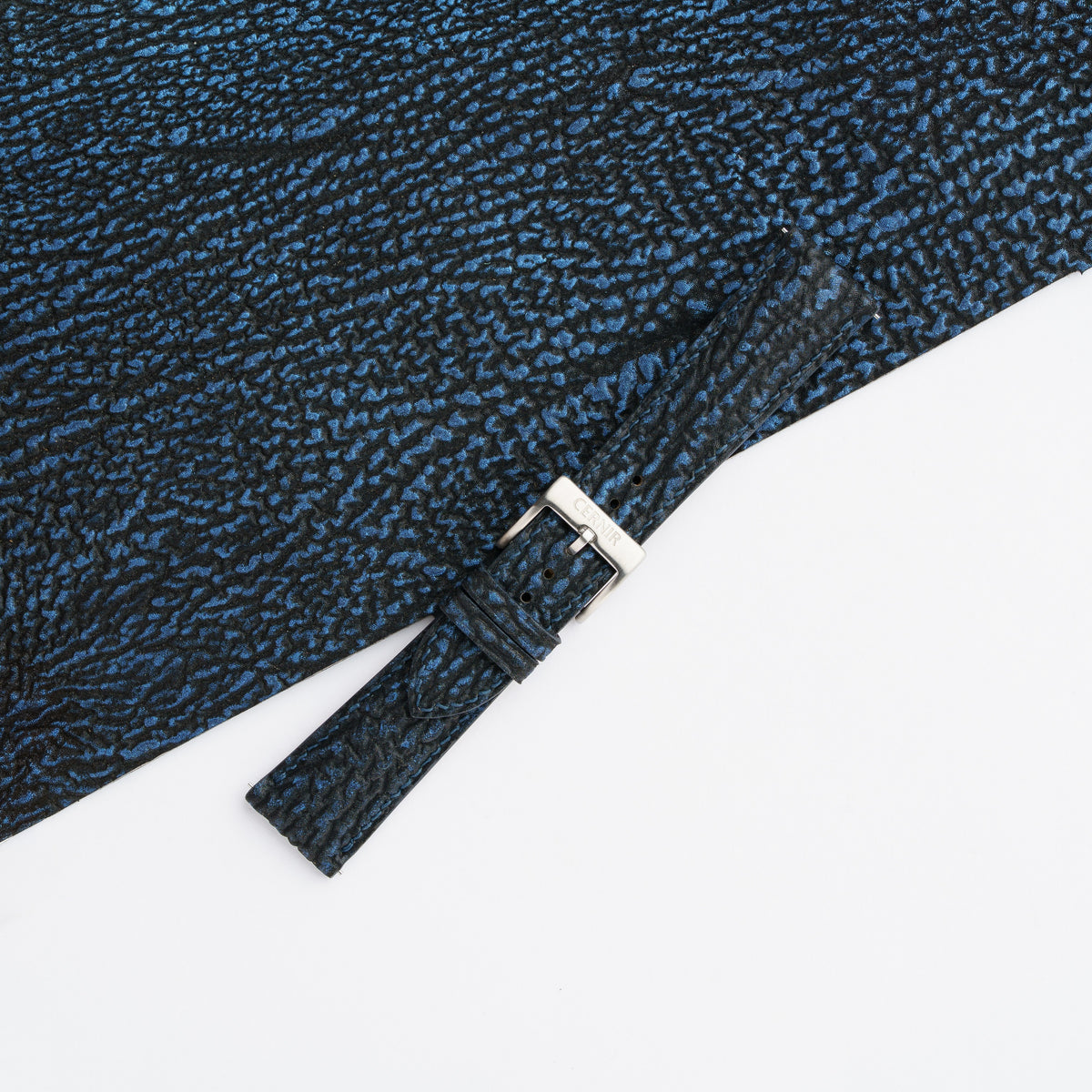 Black blue shark padded watch strap buckled with a steel pin buckle on matching shark leather