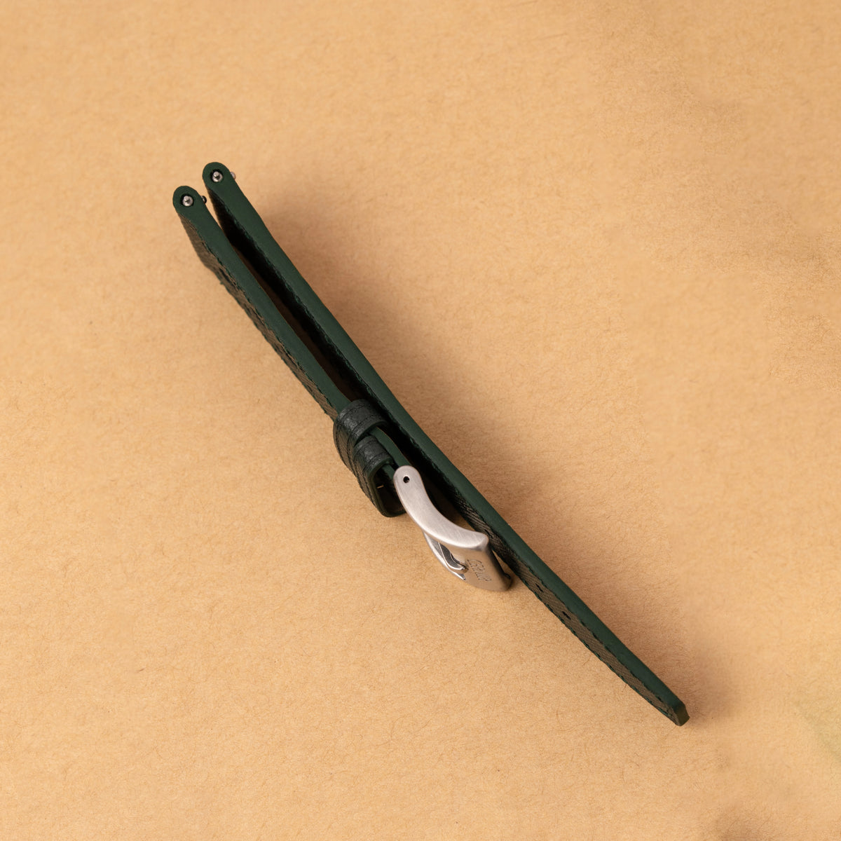 Side view of the forest green Saffiano Hybrid Rally Pilot strap folded, showing its edge