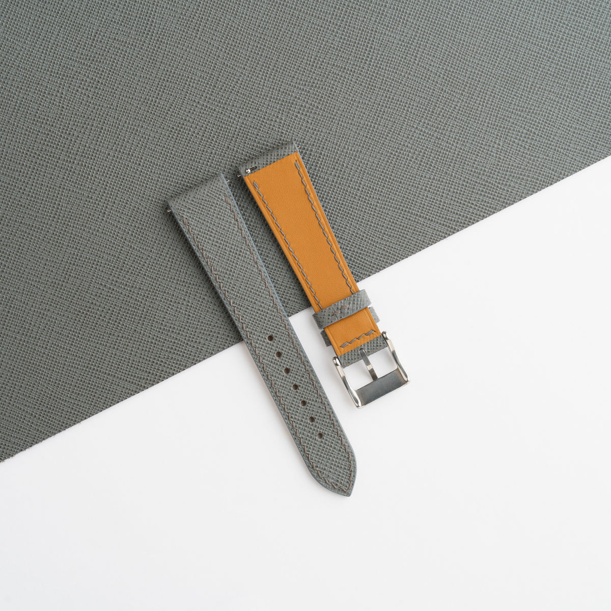Zermatt leather lining and Cernir stamp on the back of the grey Saffiano slim strap