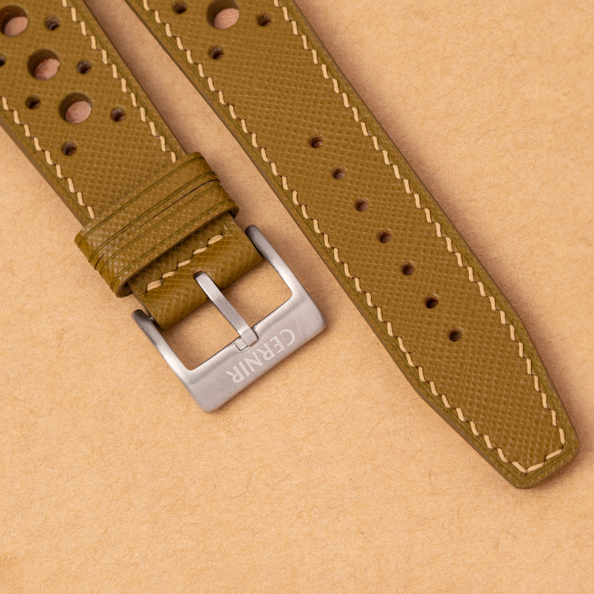 Close-up of the stitching and perforations on the mustard Hybrid Rally Pilot strap