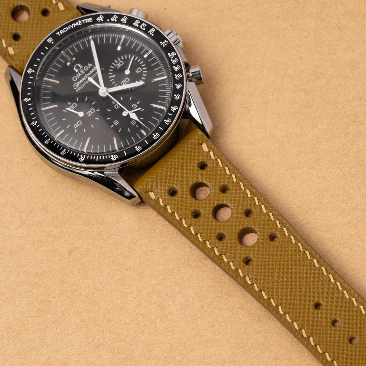 Mustard Yellow Hybrid Rally Pilot strap fitted to an Omega Speedmaster Professional with a black dial