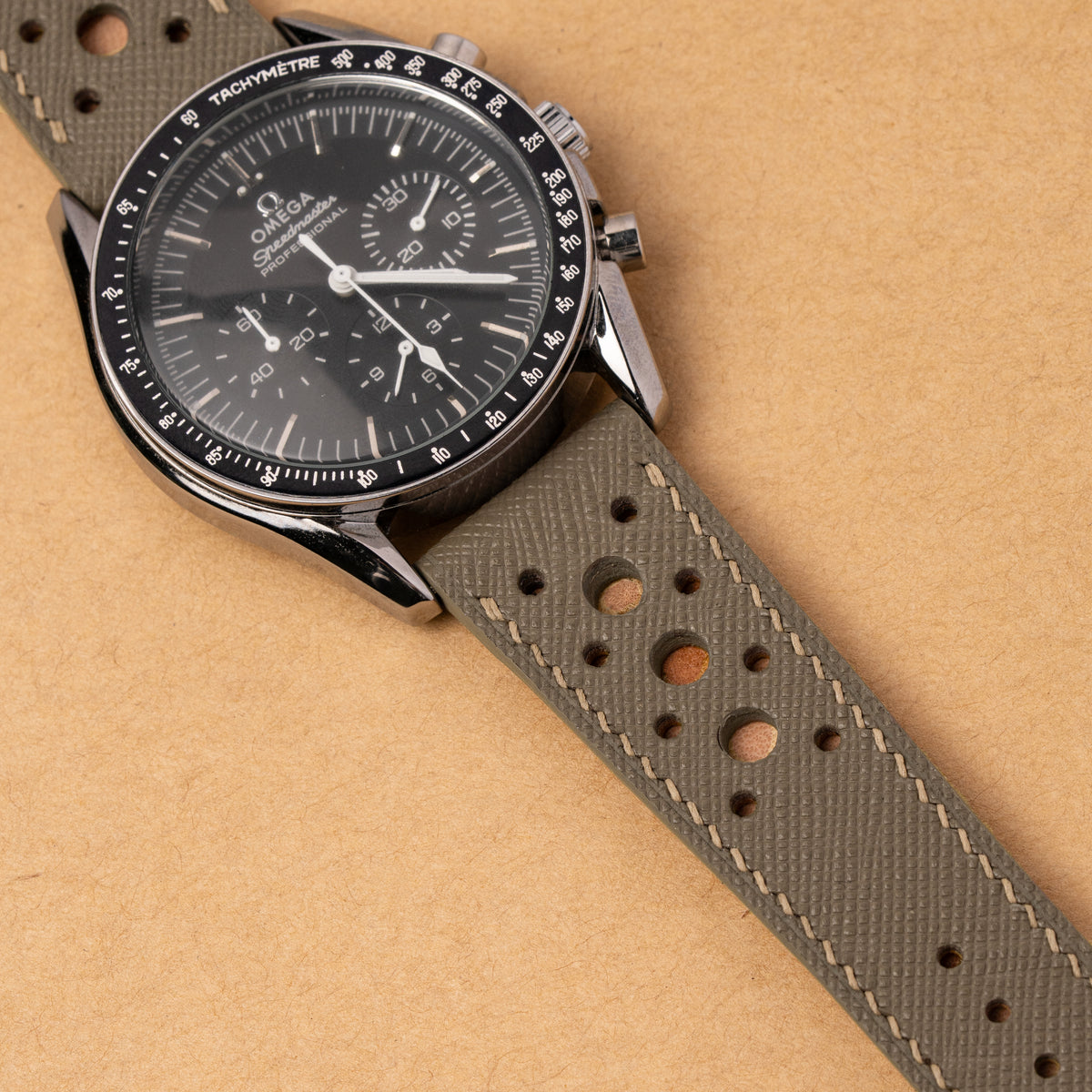 Taupe Saffiano Hybrid Rally Pilot strap fitted to an Omega Speedmaster Professional with a black dial