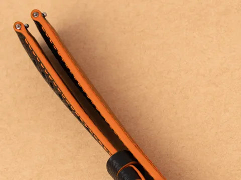 Black strap with orange painted edges