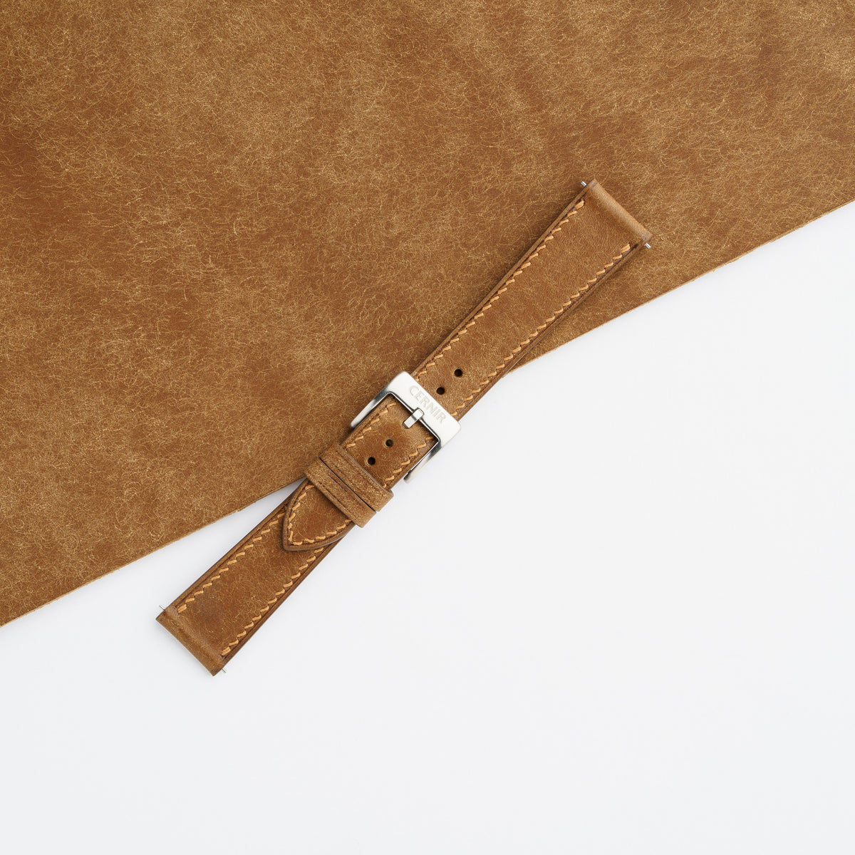 Cognac Pueblo slim watch strap with pin buckle, showing the brushed texture and natural tonal variation