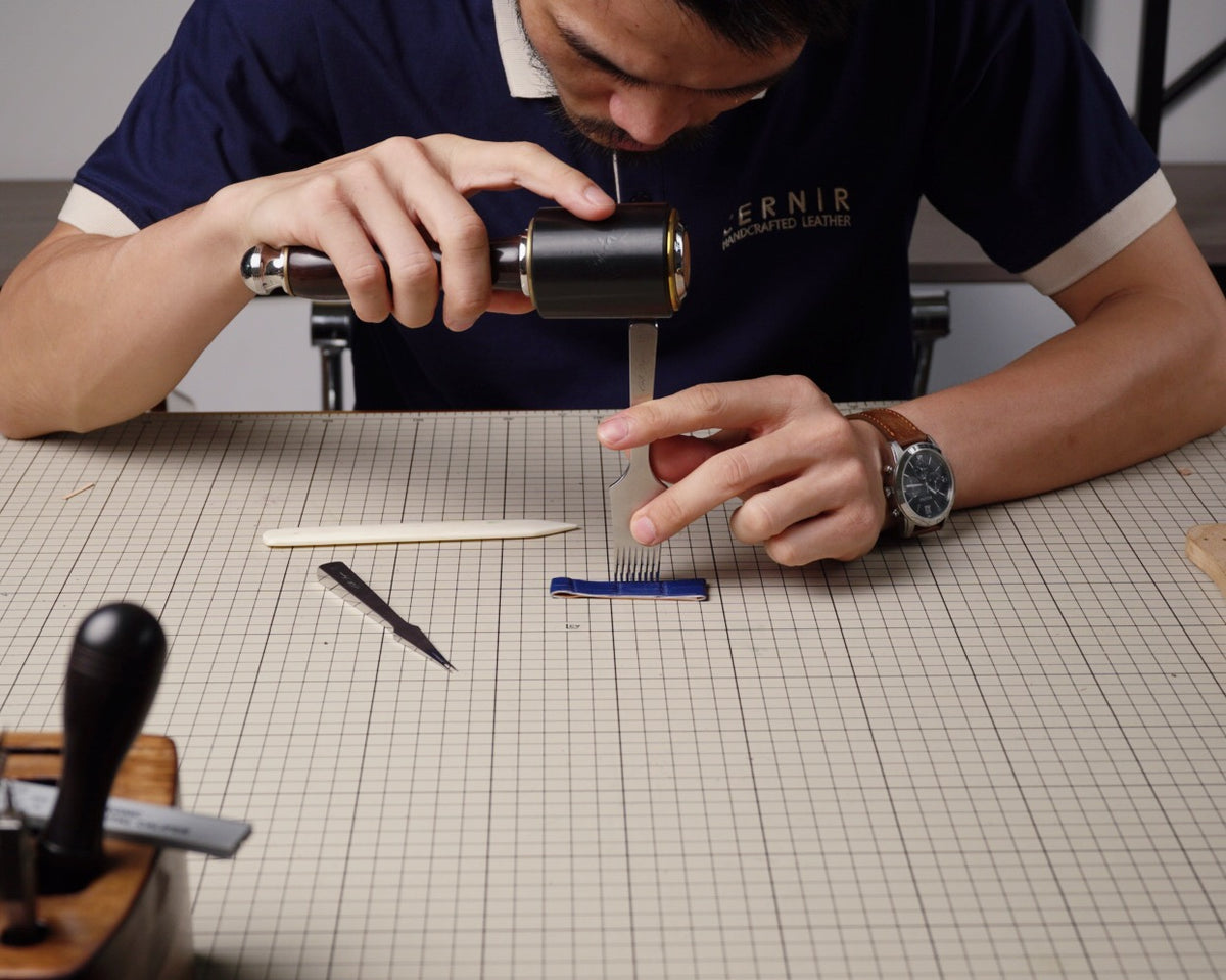 Craftsman working on a leather strap