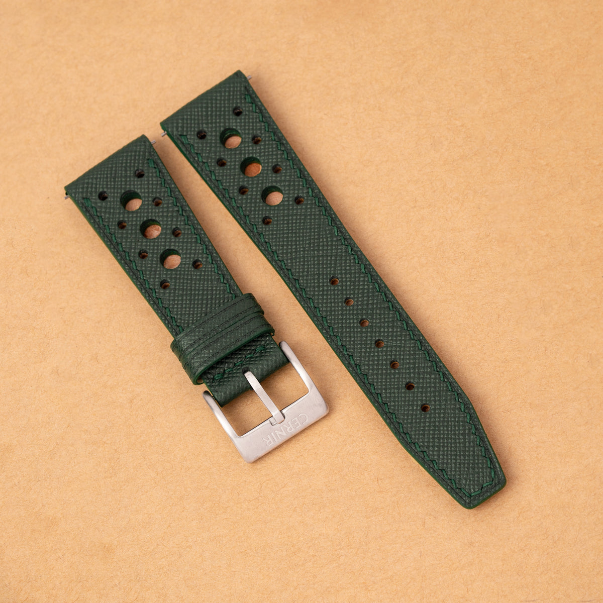 Forest Green Saffiano Hybrid Rally Pilot watch strap with green stitching on kraft paper