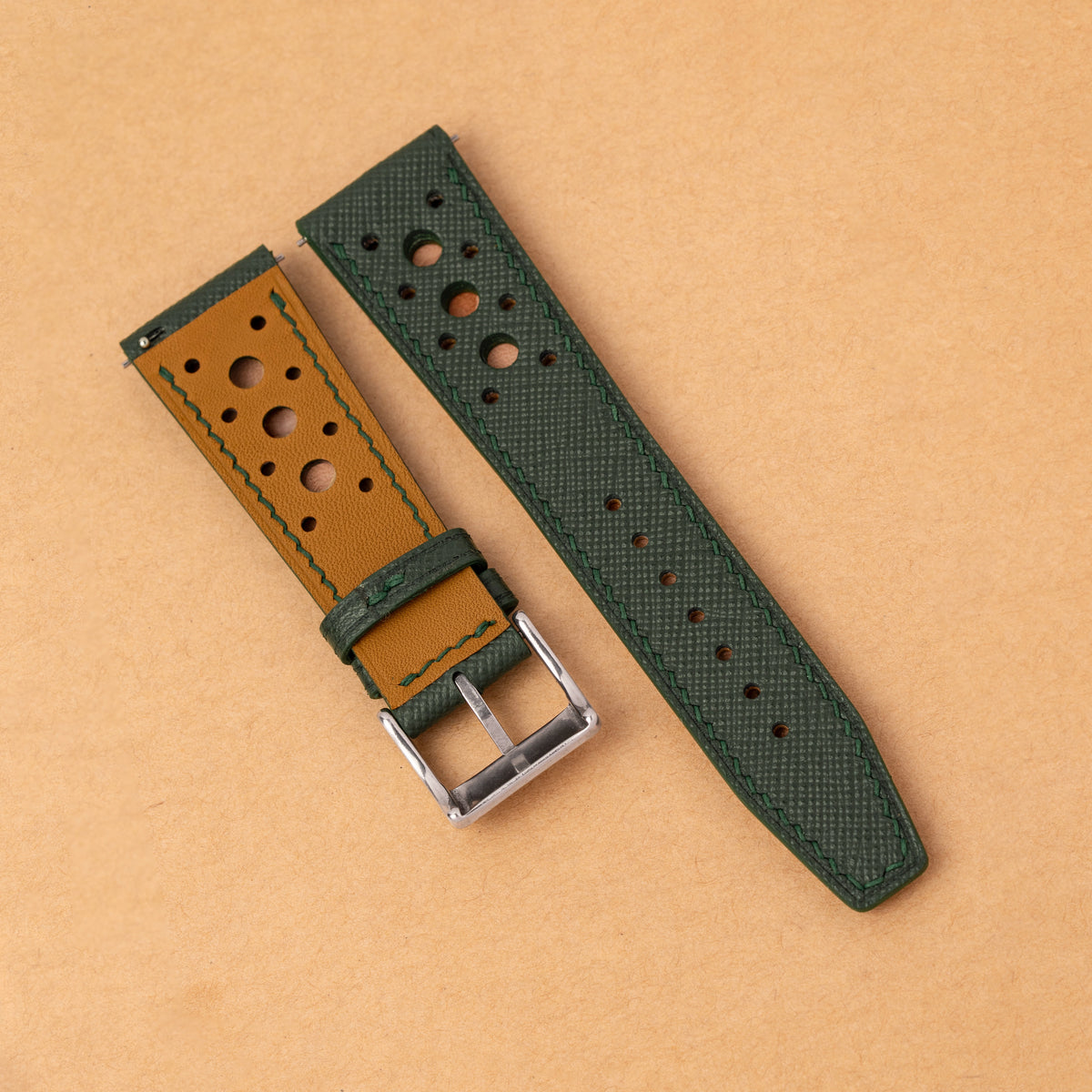 Tan lining with green stitching on the back of the forest green Hybrid Rally Pilot strap