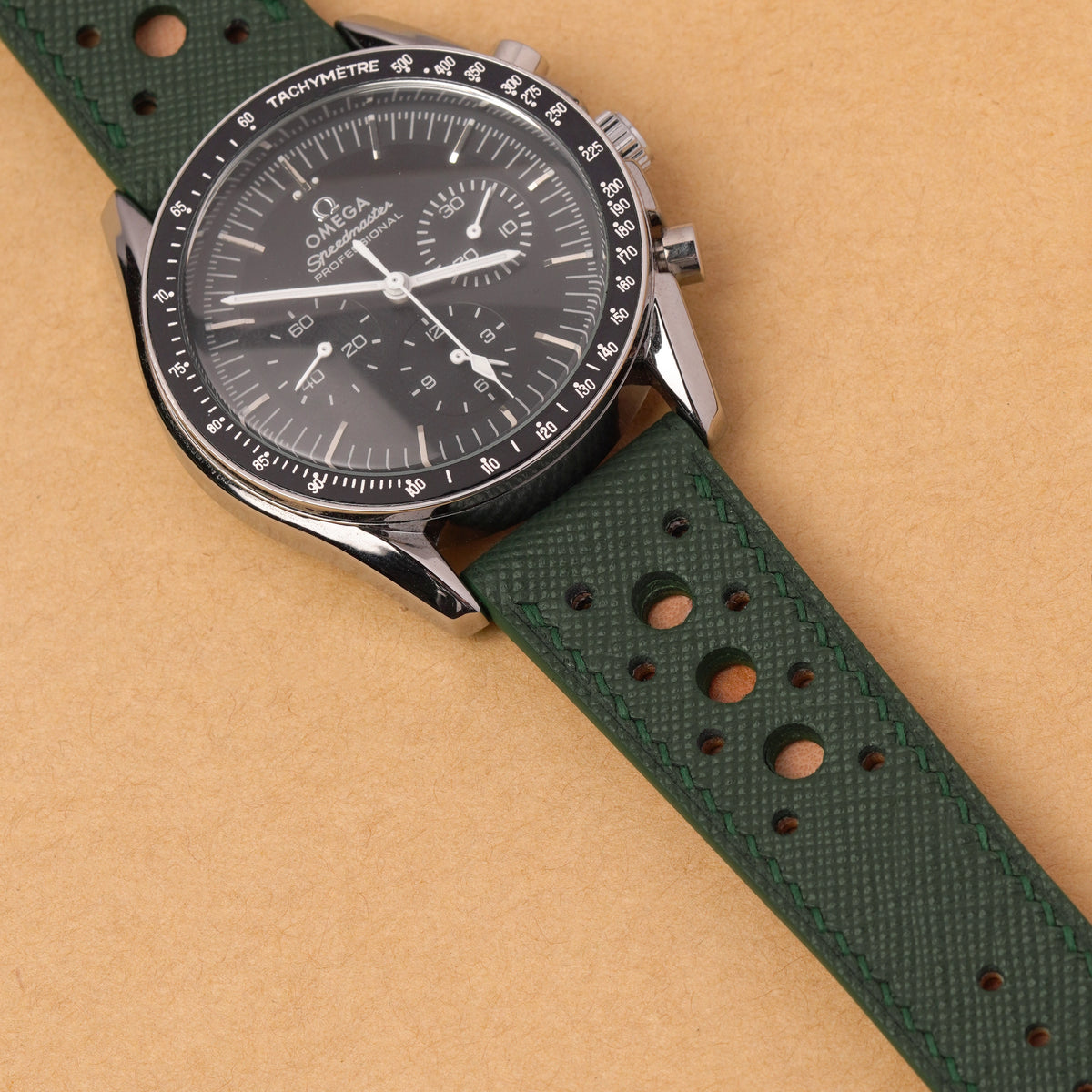Forest Green Hybrid Rally Pilot strap fitted to an Omega Speedmaster Professional with a black dial