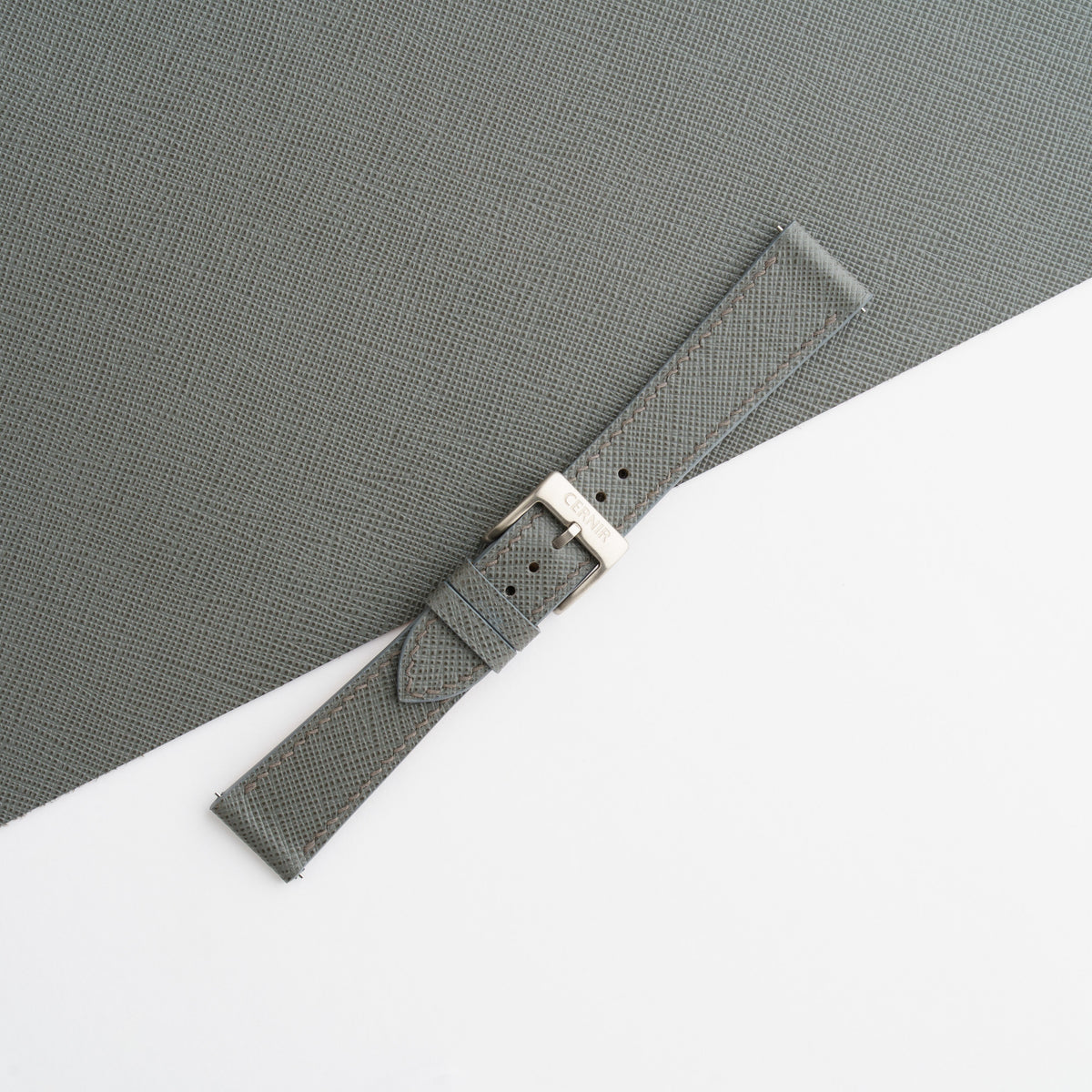 Buckled grey Saffiano slim watch strap on matching leather, showing the fine crosshatch grain
