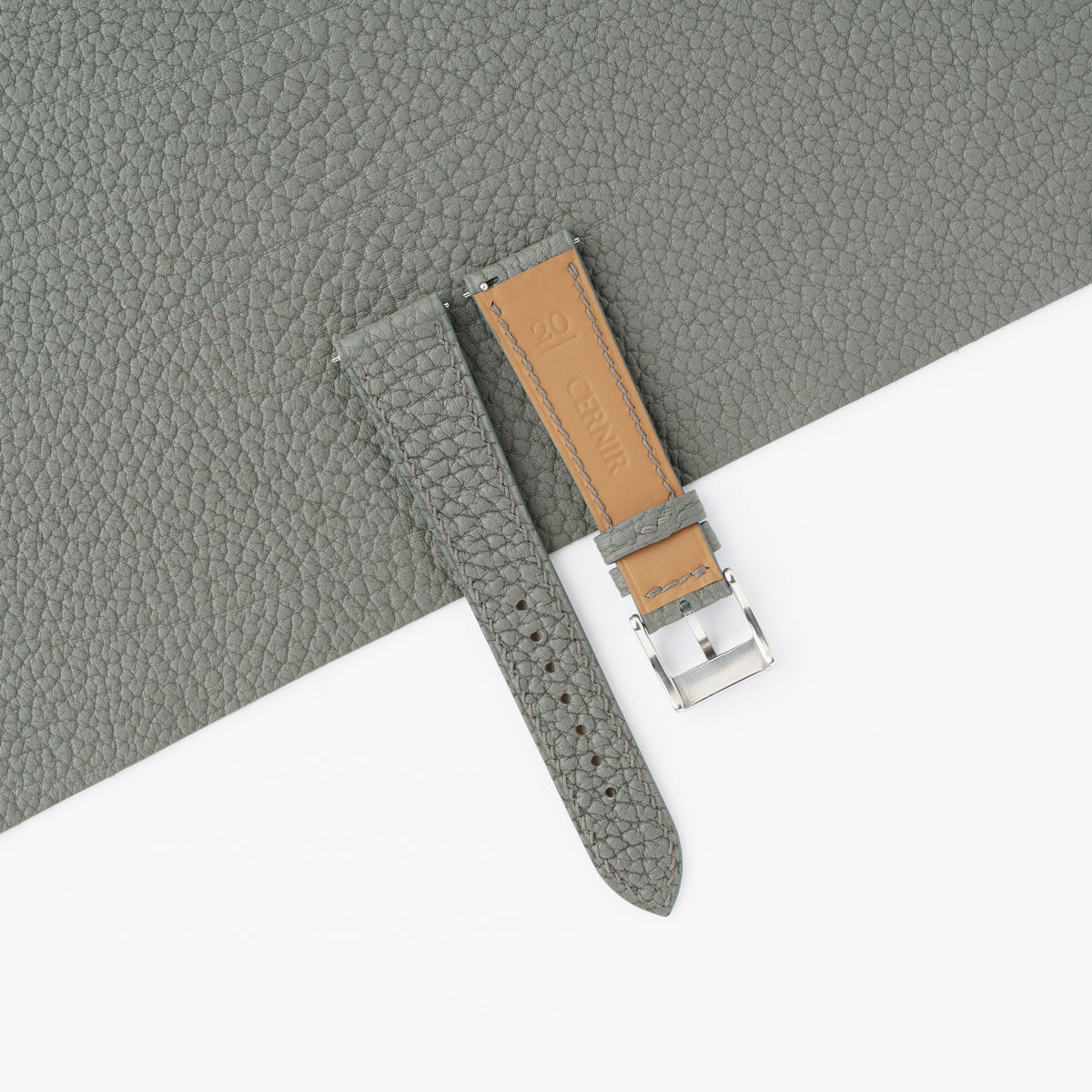 Golden Zermatt leather lining on the back of the grey Togo slim watch strap