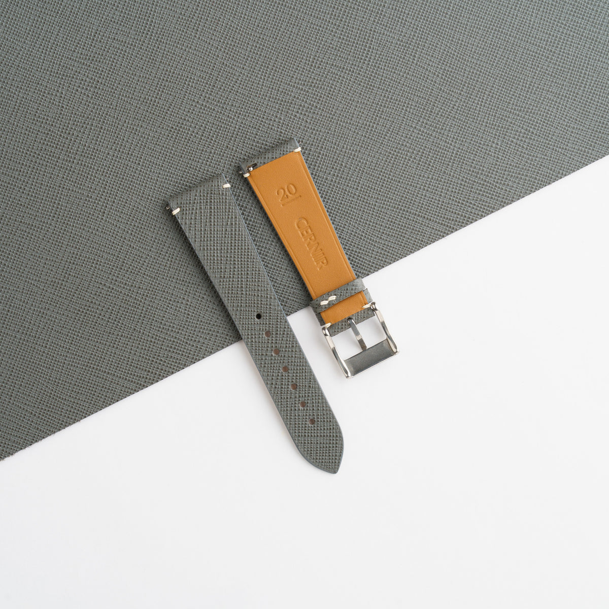 Golden tan Zermatt leather lining on the back of the grey Saffiano side-stitch strap