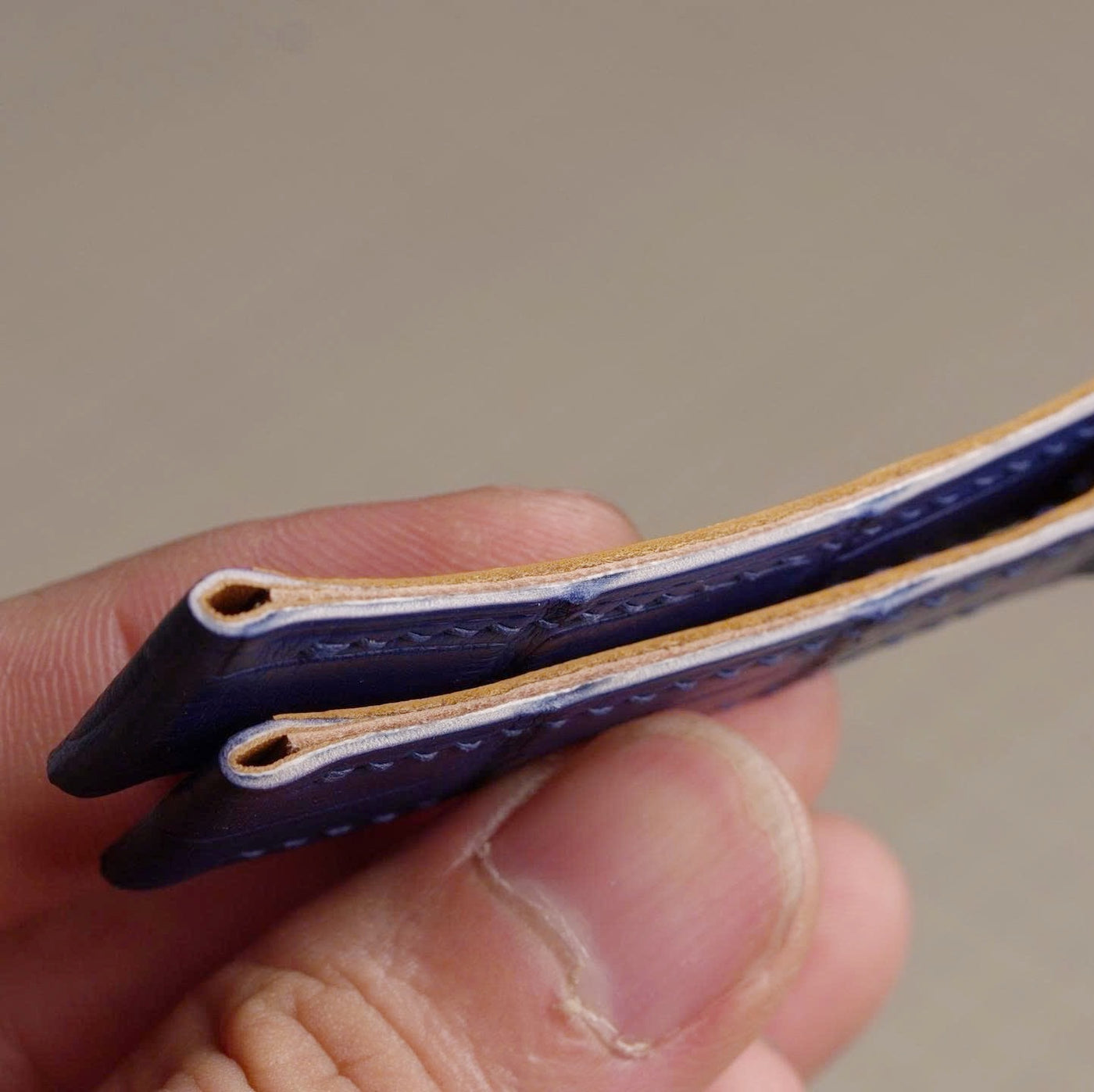 Cross section of a layered leather watch strap