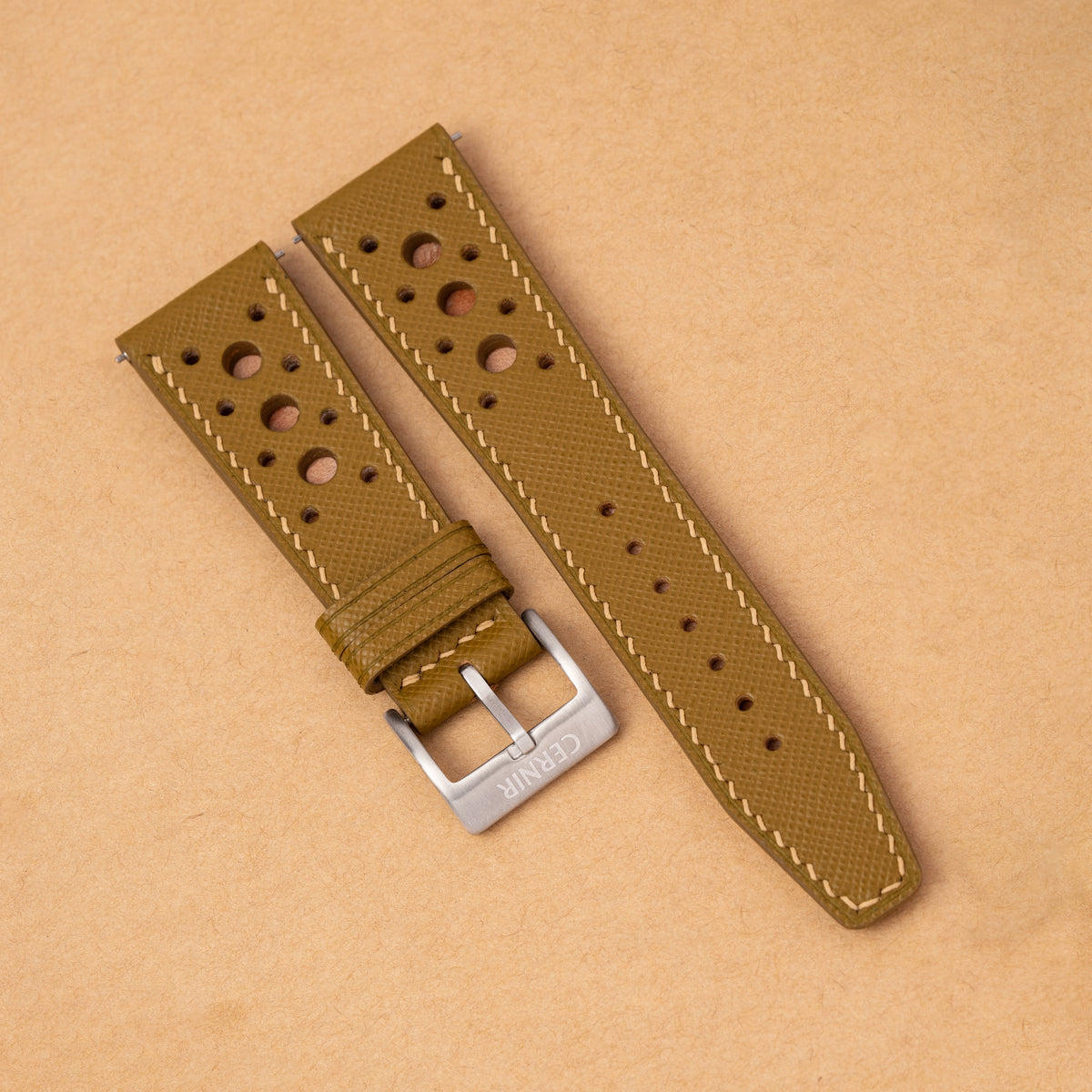 Mustard Yellow Saffiano Hybrid Rally Pilot watch strap with large round holes on kraft paper
