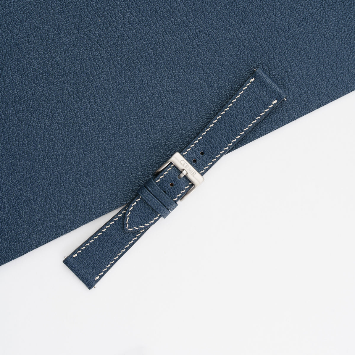 Navy Blue Alran Chevre Sully slim watch strap buckled, showing the fine goatskin grain