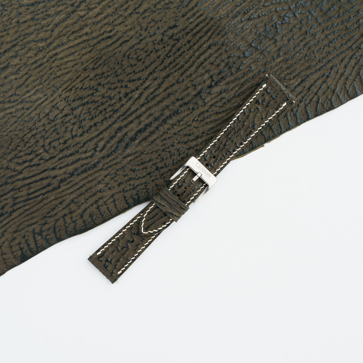 Olive brown shark slim watch strap buckled with a steel pin buckle and cream edge stitching