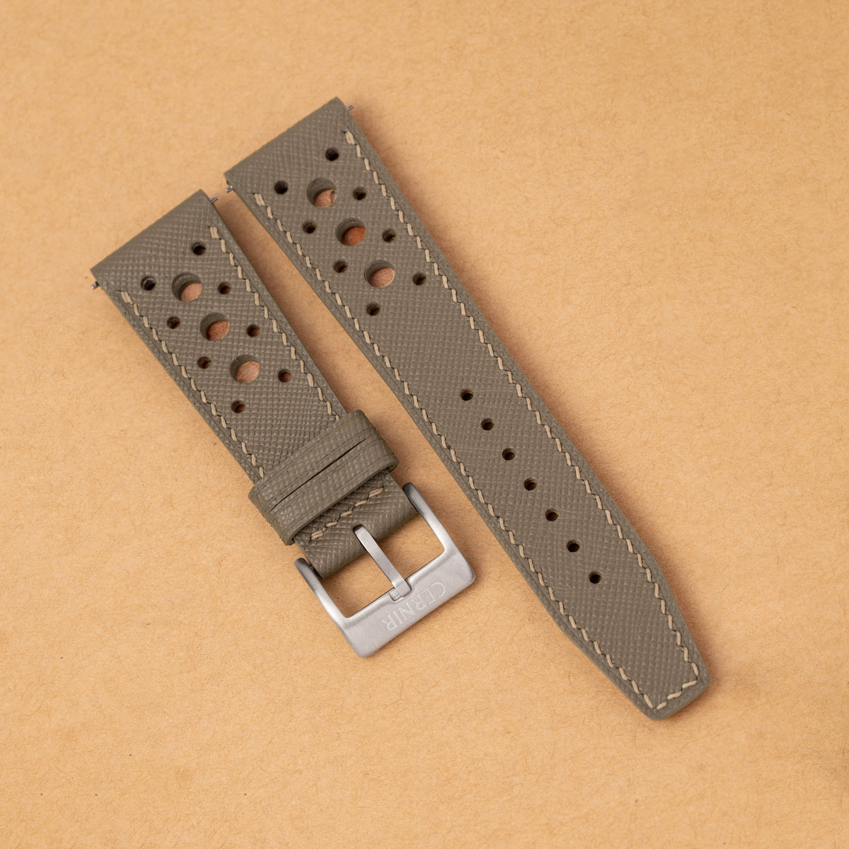 Taupe Saffiano Hybrid Rally Pilot watch strap with large round holes on kraft paper