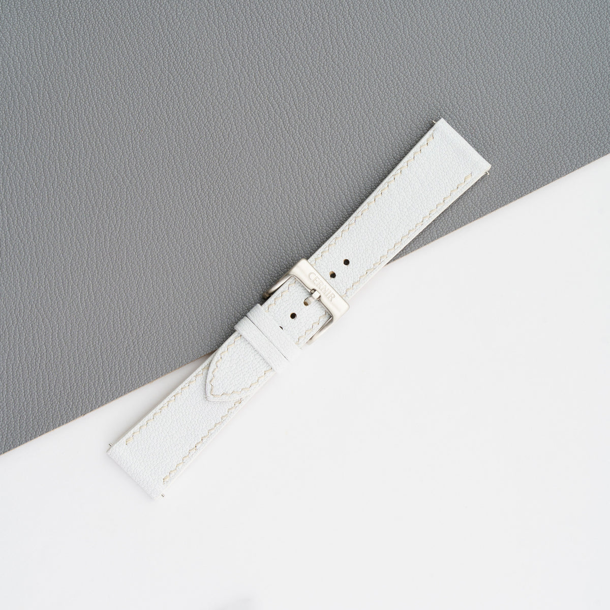 White Alran Chevre Sully slim watch strap buckled, showing the fine goatskin grain