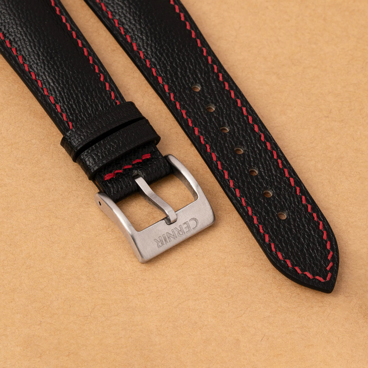 Close-up of the red hand stitching and Cernir steel buckle on the black Alran Chevre Sully padded strap