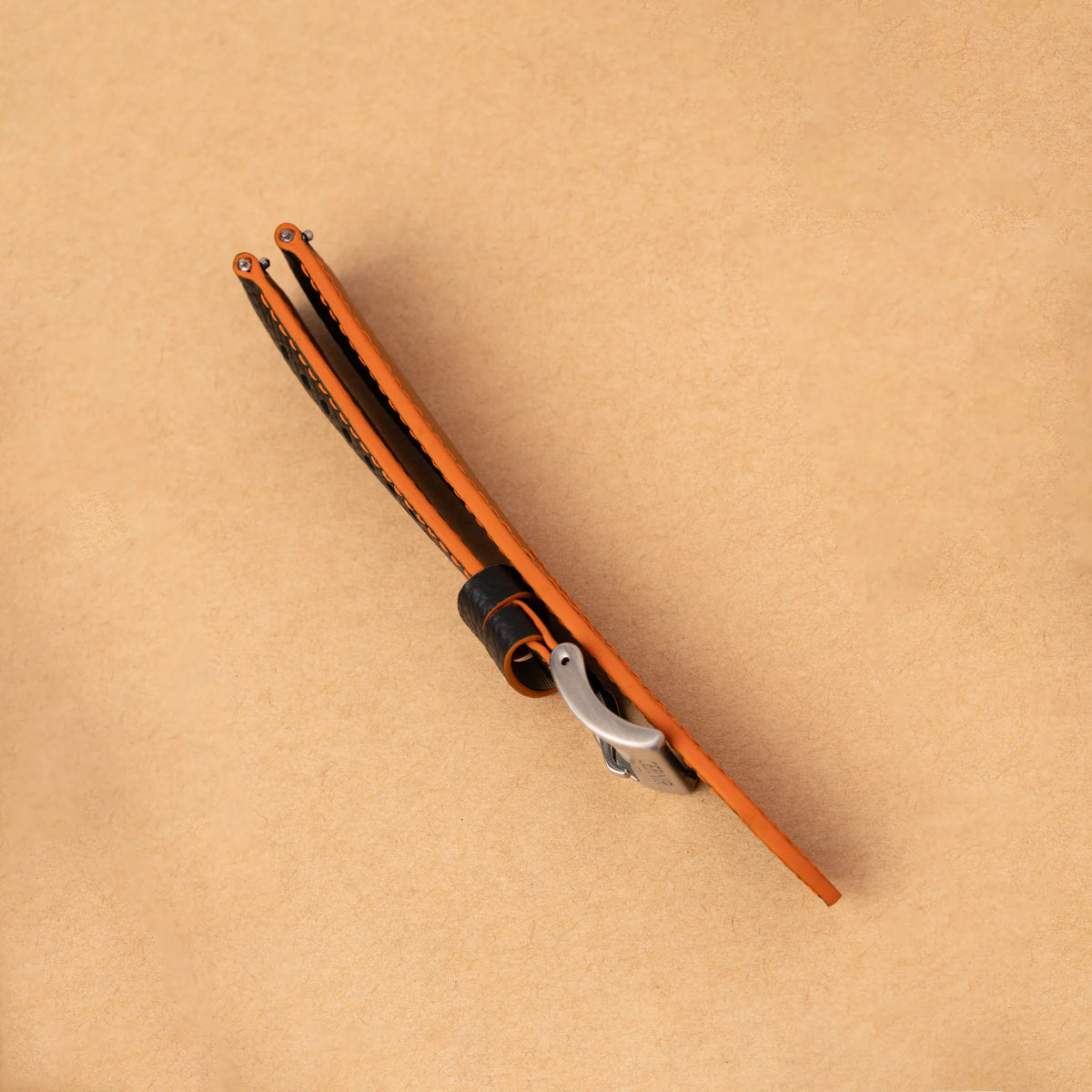 Side view of the padded black Epsom Racing Rally strap, showing its orange painted edges