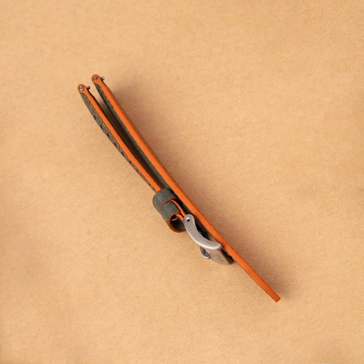 Side view of the padded grey Epsom Racing Rally strap, showing its orange painted edges