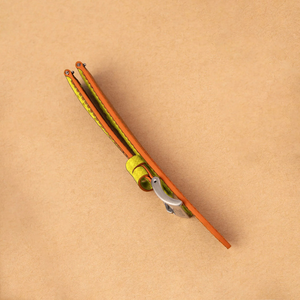 Side view of the padded lemon yellow Epsom Racing Rally strap, showing its orange painted edges