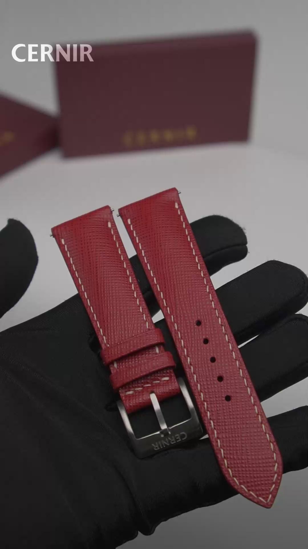 Video: Red Saffiano Leather Padded Watch Strap held in a gloved hand, showing both pieces and the buckle