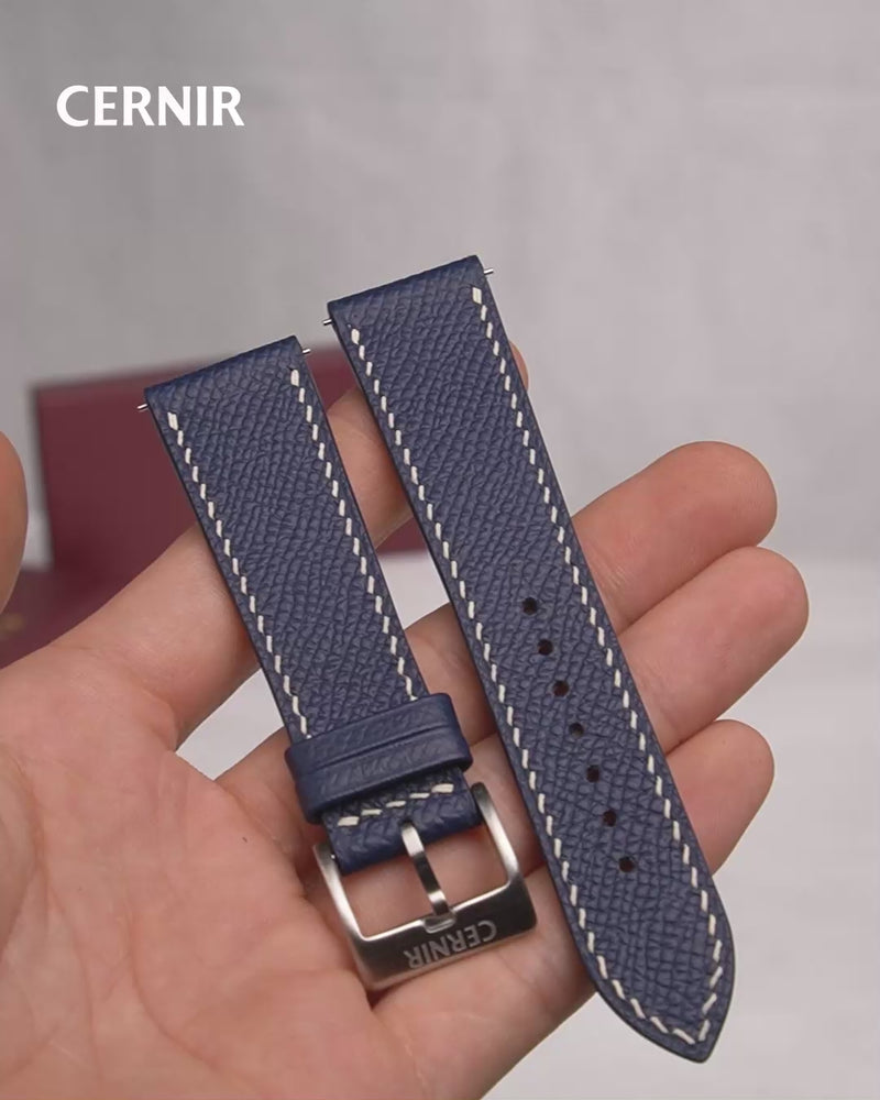 Video: Navy Epsom Leather Slim Watch Strap held in the hand, showing both pieces and the buckle