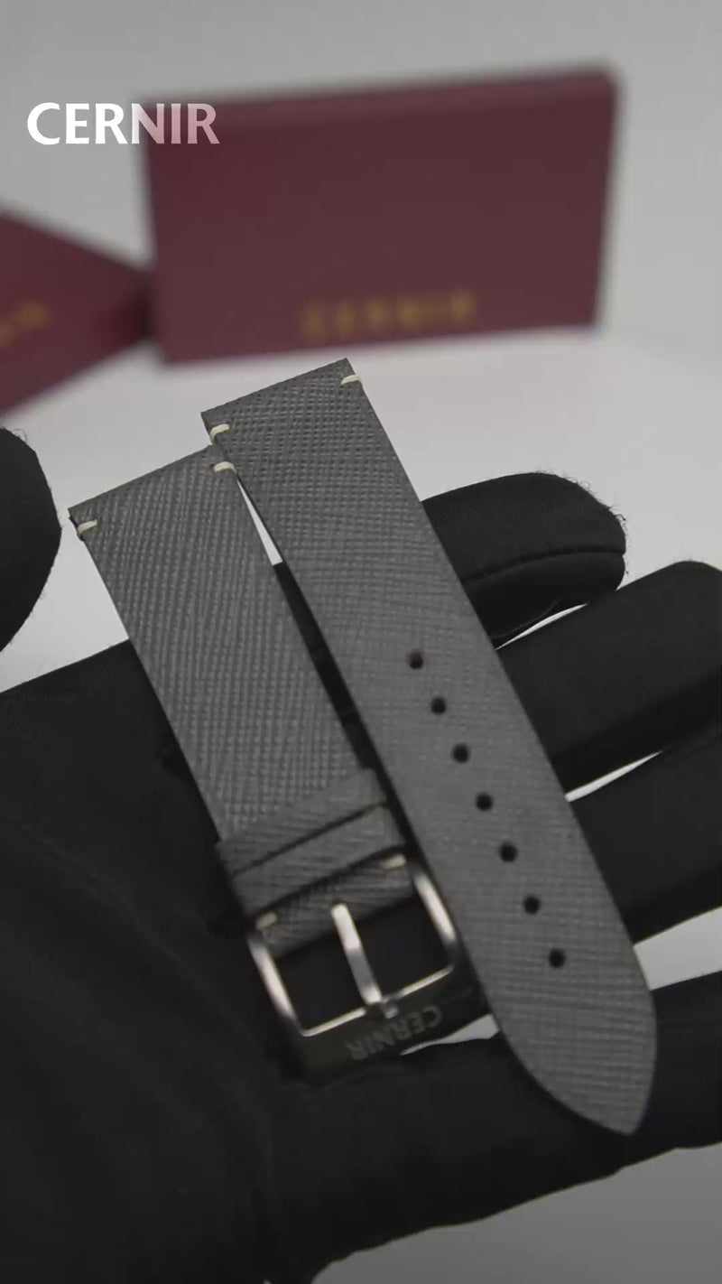 Video: Grey Saffiano Leather Side-Stitch Watch Strap held in a gloved hand, showing both pieces and the buckle