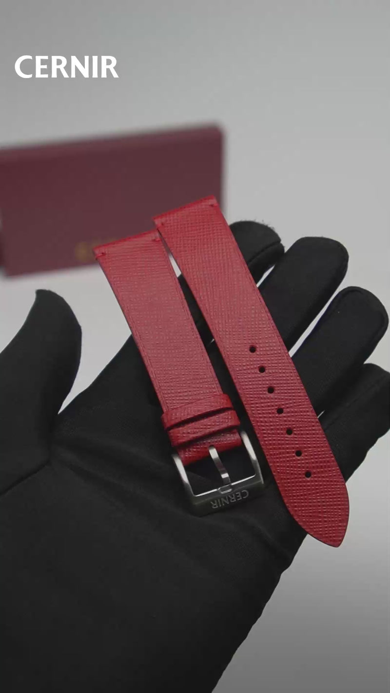 Video: Red Saffiano Leather Side-Stitch Watch Strap held in a gloved hand, showing both pieces and the buckle