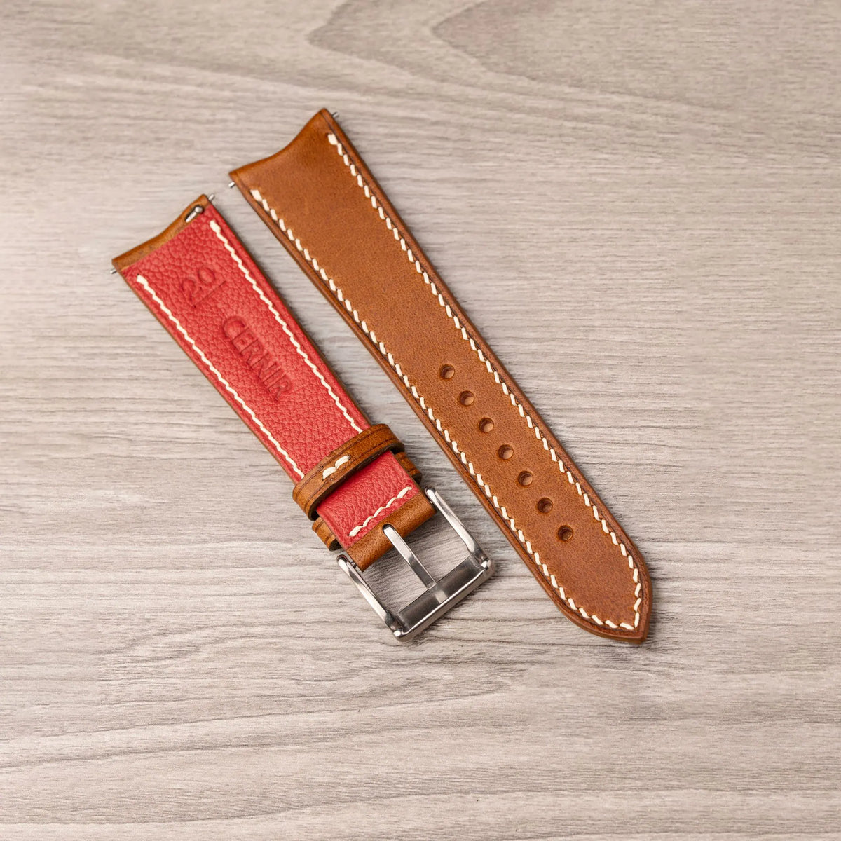 Red Alran Chevre lining with the Cernir stamp on the back of the tan Buttero curved end strap